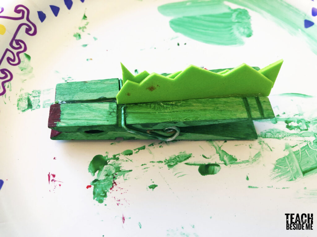 gluing clothespins and adding scales