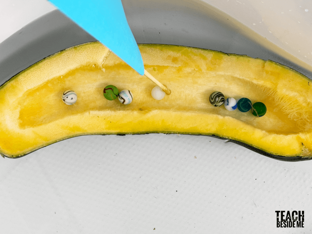 sinking a zucchini boat with marbles