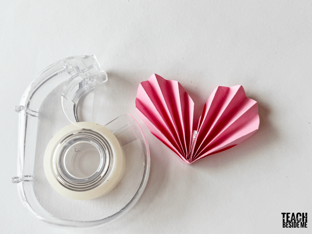 taping accordion paper heart craft