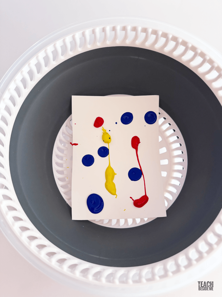 spin art painting- adding paint